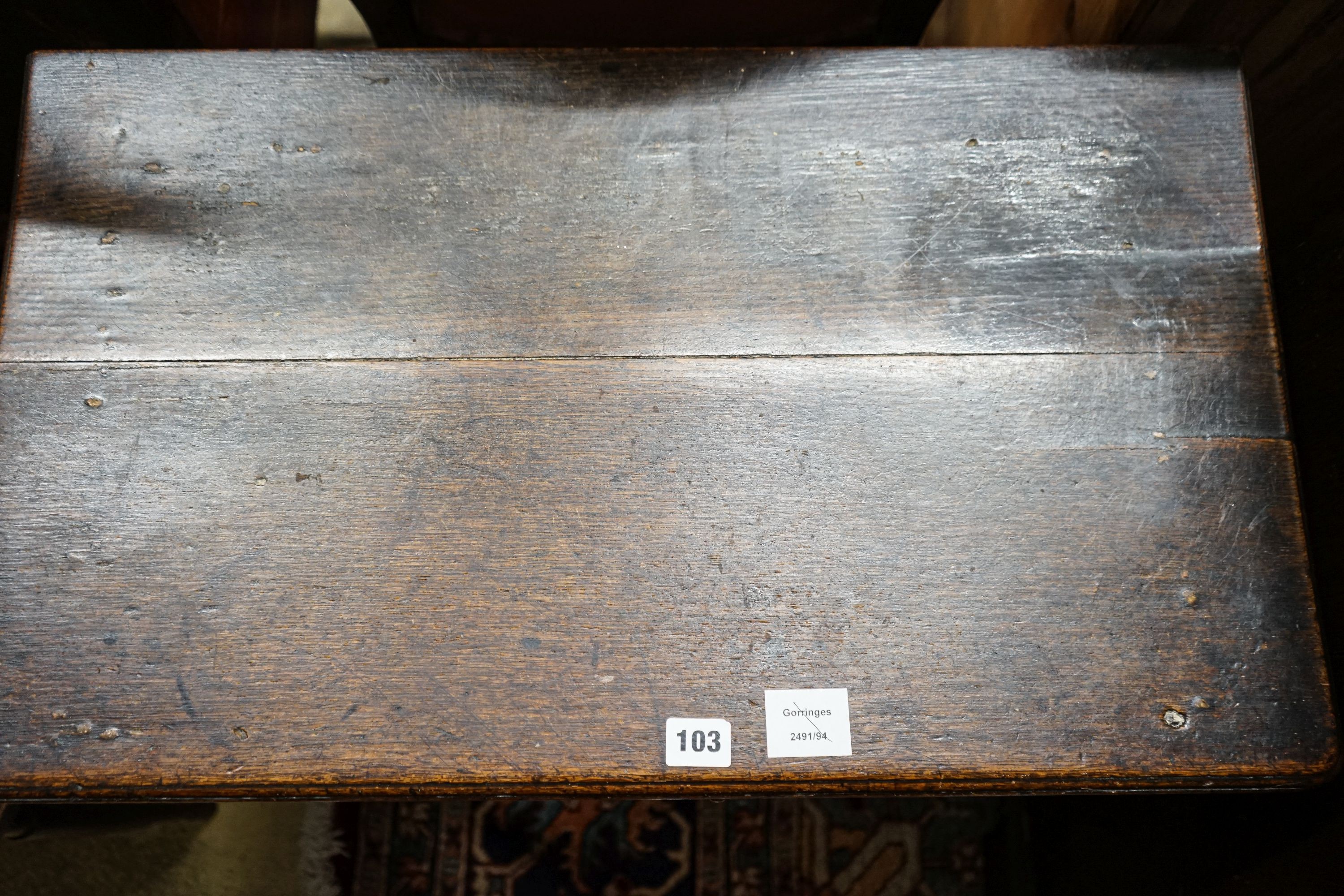 An early 18th century oak lowboy, with single drawer on slender turned legs with pad feet, width 69cm, depth 40cm, height 68cm